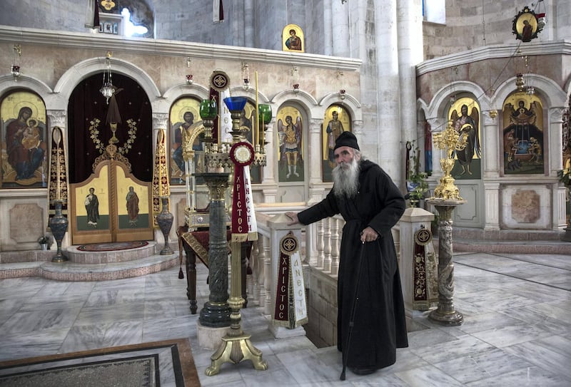 Fr Ioustinos,77, a Greek Orthodox priest and the custodian of Jacob's Well in the West Bank. Heidi Levine for The National