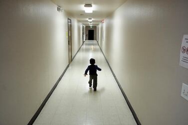 In this Dec. 11, 2018 photo, an asylum-seeking boy from Central America runs down a hallway after arriving from an immigration detention centre to a shelter in San Diego. AP Photo