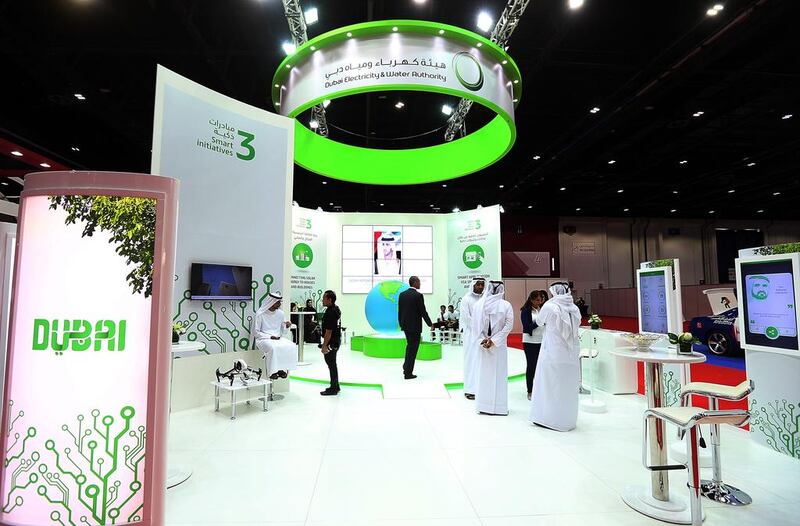 Visitors at the Dewa stand during the Smart Government Exhibition & Conference event at the Dubai World Trade Centre.  Satish Kumar / The National