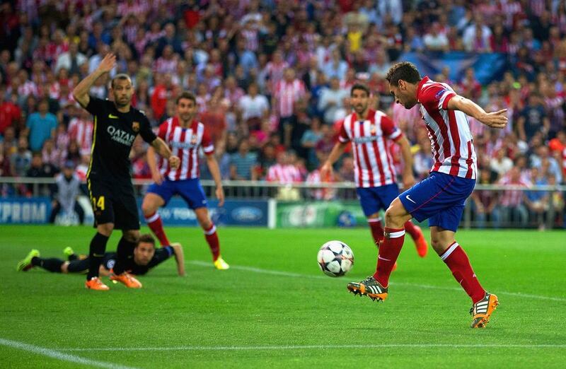 Atletico Madrid player Koke scores the opening goal against FC Barcelona on Wednesday in the Champions League. Gonzalo Arroyo Moreno / Getty Images / April 9, 2014