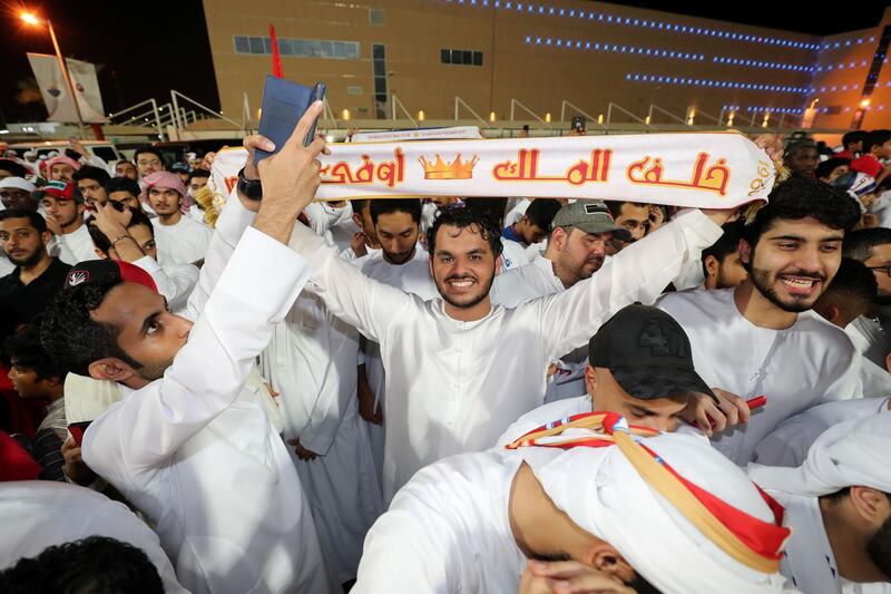 Sharjah, United Arab Emirates - May 15, 2019: Football. Sharjah fans celebrate winning the league after the game between Sharjah and Al Wahda in the Arabian Gulf League. Wednesday the 15th of May 2019. Sharjah Football club, Sharjah. Chris Whiteoak / The National