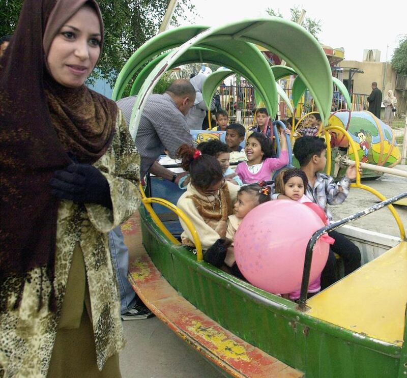 Children celebrate Eid Al Fitr in Baghdad in 2004. This year festivities in the region have been subdued. Mohammed Fala’ah / Getty Images

