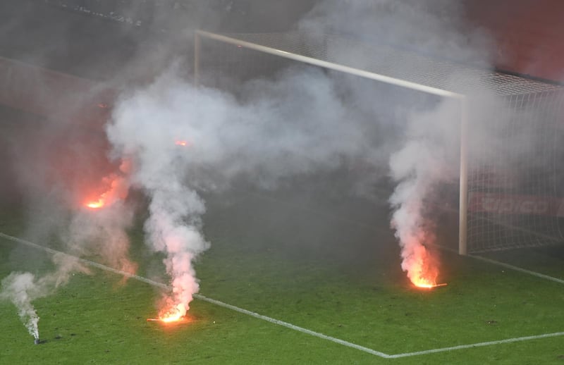 HSV supporters light flares during the German Bundesliga soccer match between Hamburger SV and Borussia Moenchengladbach in Hamburg, Germany, , on May 12, 2018. David Hecker / EPA
