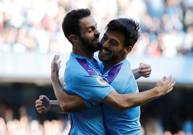 Manchester City's Bernardo Silva celebrates scoring their sixth goal with teammate David Silva. Reuters