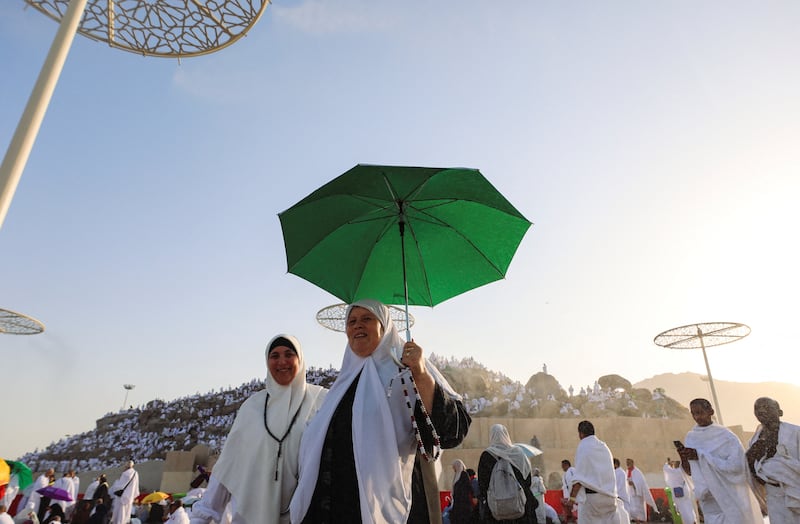 Muslim pilgrims carry umbrellas to protect them from the sun's rays during Hajj as temperatures reach 46°C at Mount Arafat, near Makkah, on Tuesday. Reuters