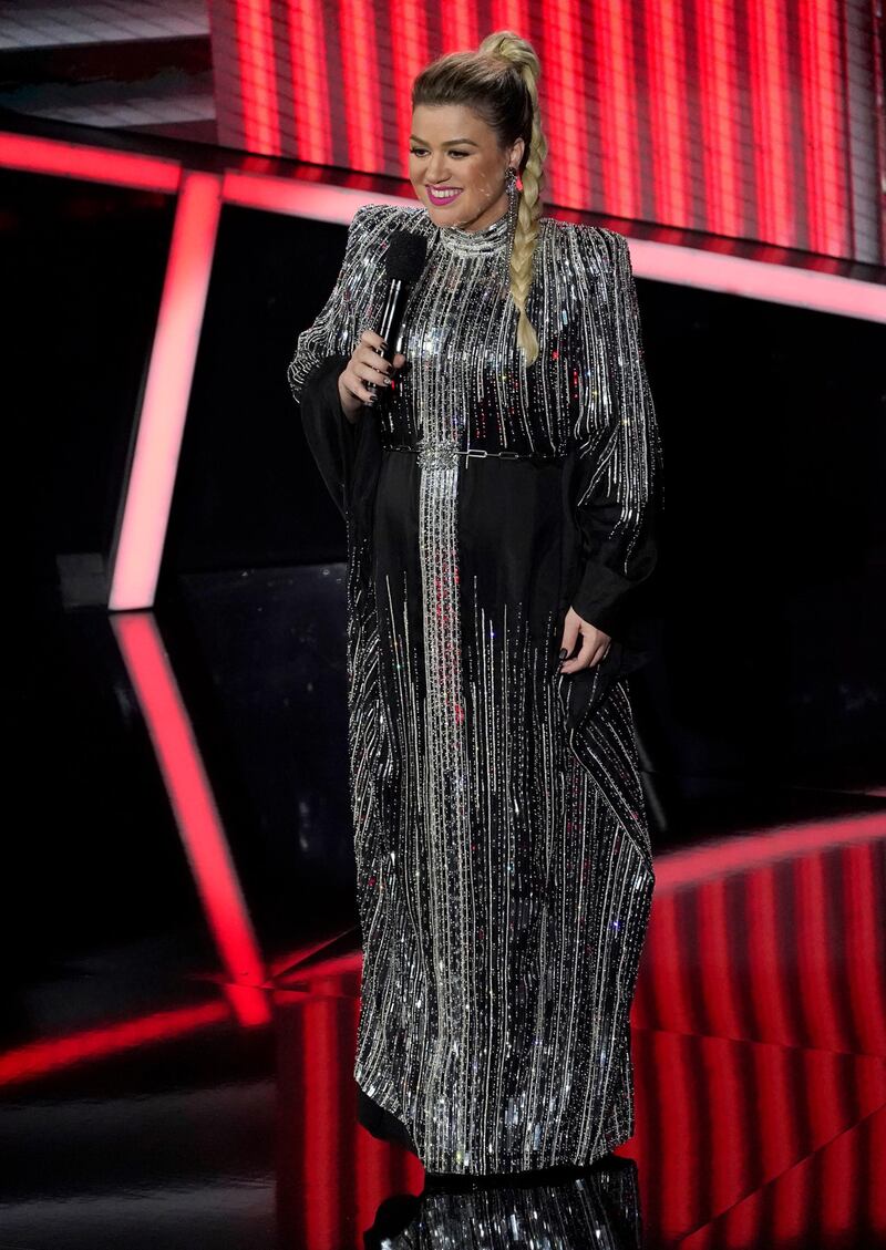 Host Kelly Clarkson changes into a black and silver embellished Balmain gown at the Billboard Music Awards. AP