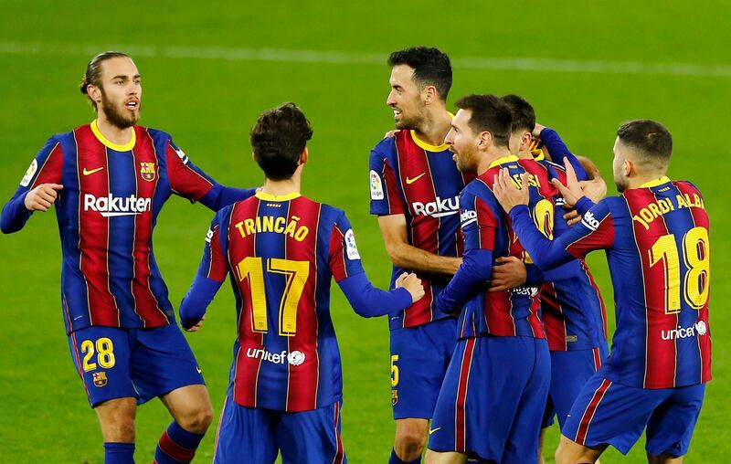 Soccer Football - La Liga Santander - Real Betis v FC Barcelona - Estadio Benito Villamarin, Seville, Spain - February 7, 2021 Barcelona's Lionel Messi celebrates scoring their first goal with teammates REUTERS/Marcelo Del Pozo