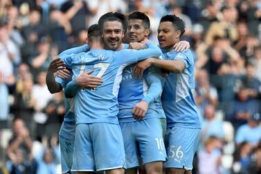 Manchester City's Phil Foden (L), embraced by Manchester City's Jack Grealish (2-nd L) and teammates, reacts after the English Premier League soccer match between Manchester City and Newcastle United in Manchester, Britain, 08 May 2022.   EPA/PETER POWELL EDITORIAL USE ONLY.  No use with unauthorized audio, video, data, fixture lists, club/league logos or 'live' services.  Online in-match use limited to 120 images, no video emulation.  No use in betting, games or single club / league / player publications