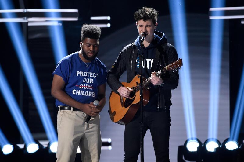 Khalid, left, and Shawn Mendes perform "Youth" with the Stoneman Douglas choir, of the Marjory Stoneman Douglas High School. AP