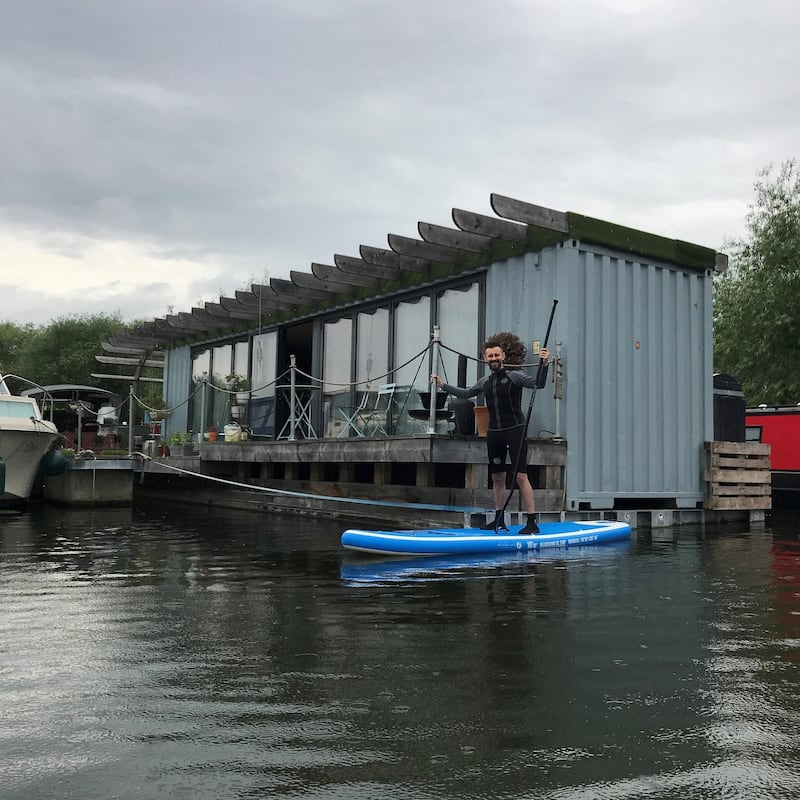 British upcycler Max McMurdo built his own boat home out of an old shipping container and now lives on the vessel full-time. Courtesy Max McMurdo