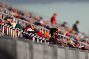 Spectators watch the second practice session for the Australian Formula One Grand Prix in Melbourne, Australia, Friday, April 8, 2022.  (AP Photo / Asanka Brendon Ratnayake)