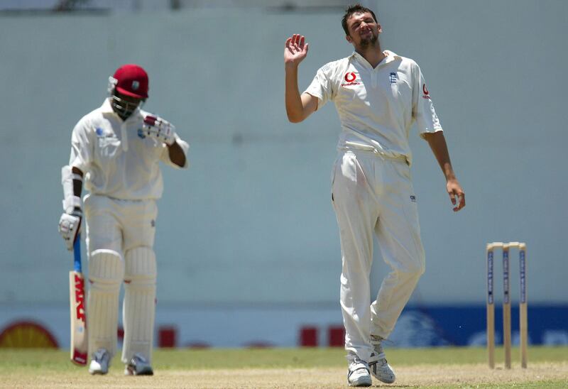ST JOHNS, ANTIGUA - APRIL 12:  Steve Harmison of England feels the strain as Brian Lara looks on during day three of the fourth Test match between the West Indies and England at the Recreation Ground on April 12, 2004 in St Johns, Antigua. (Photo by Clive Rose/Getty Images).