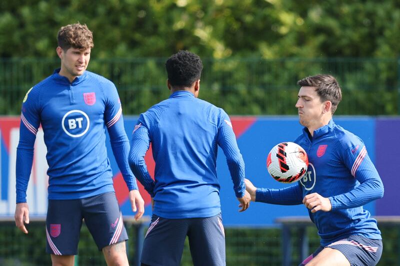 England defender Harry Maguire controls the ball at Hotspur Way Training Ground in Enfield, on Monday, March 28, 2002. England take on Ivory Coast in a friendly match at Wembley on Tuesday. AFP