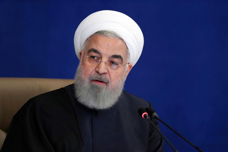 In this photo released by the official website of the office of the Iranian Presidency, President Hassan Rouhani speaks in a meeting in Tehran, Iran, on Dec. 9, 2020. The Biden administration is weighing a near wholesale rollback of some of the most stringent Trump-era sanctions imposed on Iran, in a bid to get the Islamic Republic to return to compliance with a landmark 2015 nuclear accord. (Iranian Presidency Office via AP)