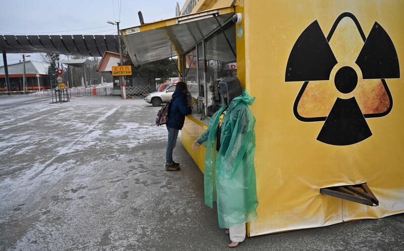 A visitor stands in front of a souvenir booth next to the Dytyatky control point at an entrance to Chernobyl’s exclusion zone.  AFP