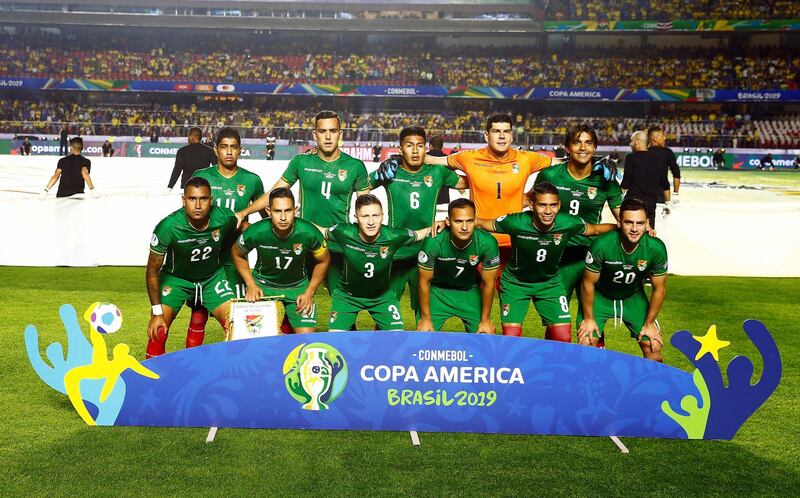 The Bolivian team pose for a picture before kick off. EPA