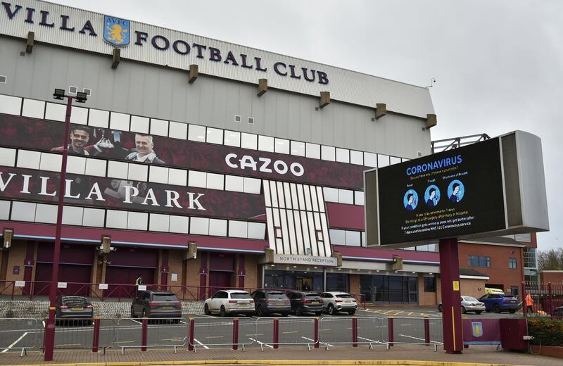 FILE - This Saturday, Nov. 21, 2020 file photo shows a general view of a social distancing message on display outside the Villa Park stadium, home of Aston Villa, in Birmingham, England. Aston Villa has on Thursday, Jan. 7, 2021 reported a â€œsignificantâ€ coronavirus outbreak and closed its training ground a day before a scheduled FA Cup home game against Liverpool. Villa says â€œdiscussions are ongoing between medical representatives of the club, the Football Association and the Premier League.â€ (AP Photo/Rui Vieira, file)