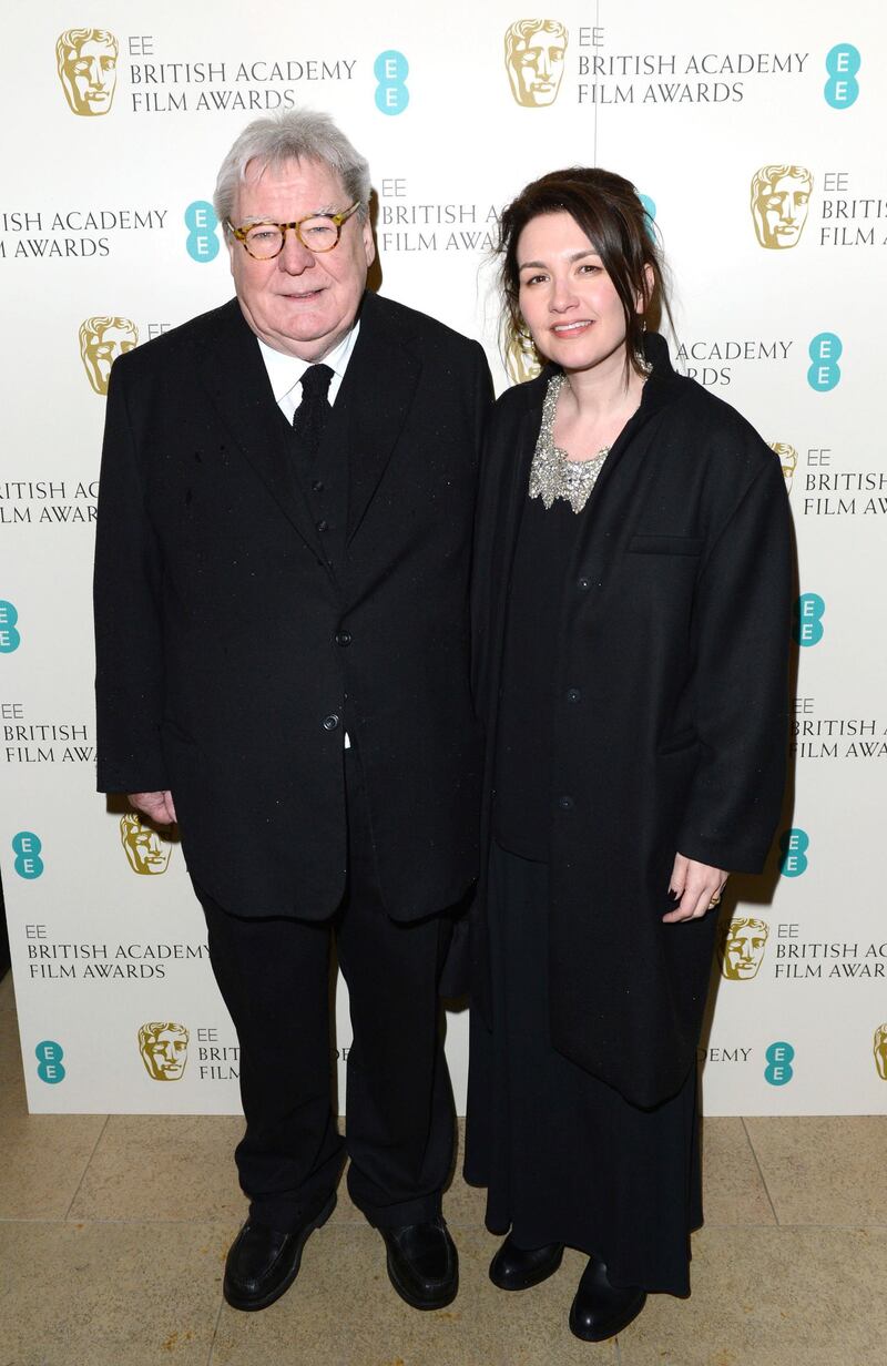 Director Alan Parker and his wife, Lisa arrive for the Bafta Film Awards in London on February 10, 2013. AP file