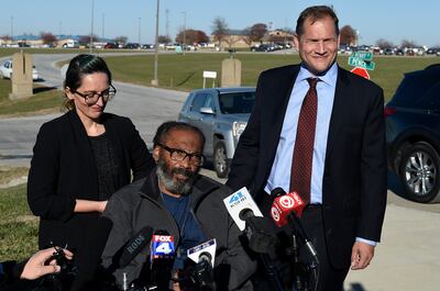 Kevin Strickland, centre, with his attorneys. Mr Strickland was jailed for more than 40 years for three murders. He was released after a judge ruled that he was wrongfully convicted in 1979. AP