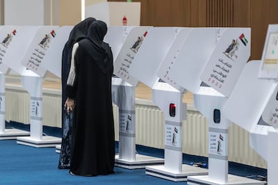 Voters in Sharjah cast their ballots in the Federal National Council elections at the Sharjah polling station. Antonie Robertson / The National