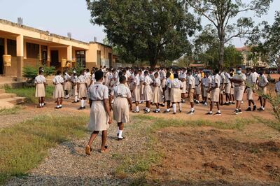 Students assemble on their school compound on the first day of the reopening of schools in Accra, Ghana, on January 18, 2021.  Ghana reopened schools after a 10-month closure to help control the spread of the COVID-19 coronavirus. / AFP / Nipah Dennis
