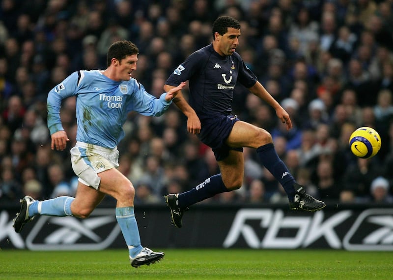 MANCHESTER, ENGLAND - DECEMBER 11:  Noureddine Naybet of Tottenham Hotspur beats Jon Macken of Manchester City during the Barclays Premiership match between Manchester City and Tottenham Hotspur at the City of Manchester Stadium on December 11, 2004 in Manchester, England.  (Photo by Alex Livesey/Getty Images)