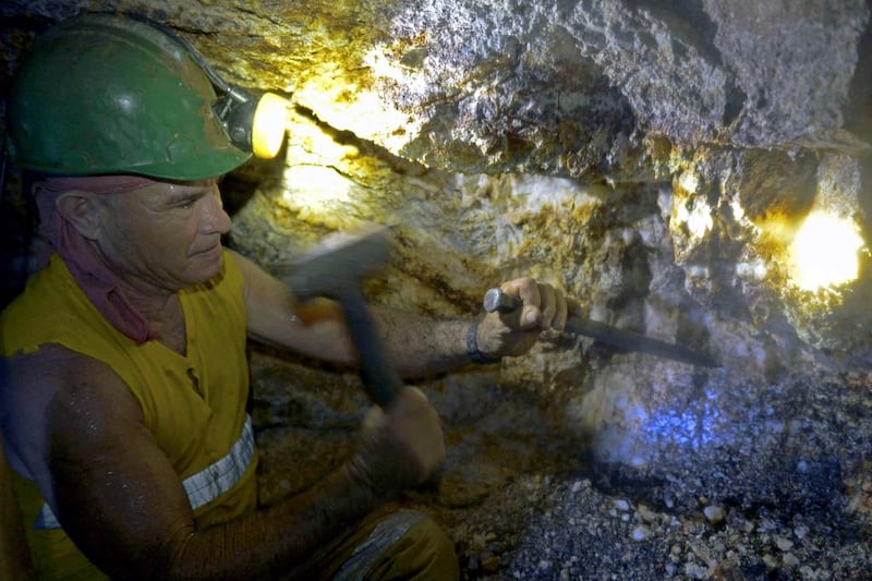 A miner works at an unlicensed gold mine in Segovia. Colombia has more than 14,350 mines, more than half of which operate without proper permits. Raul Arboleda / AFP