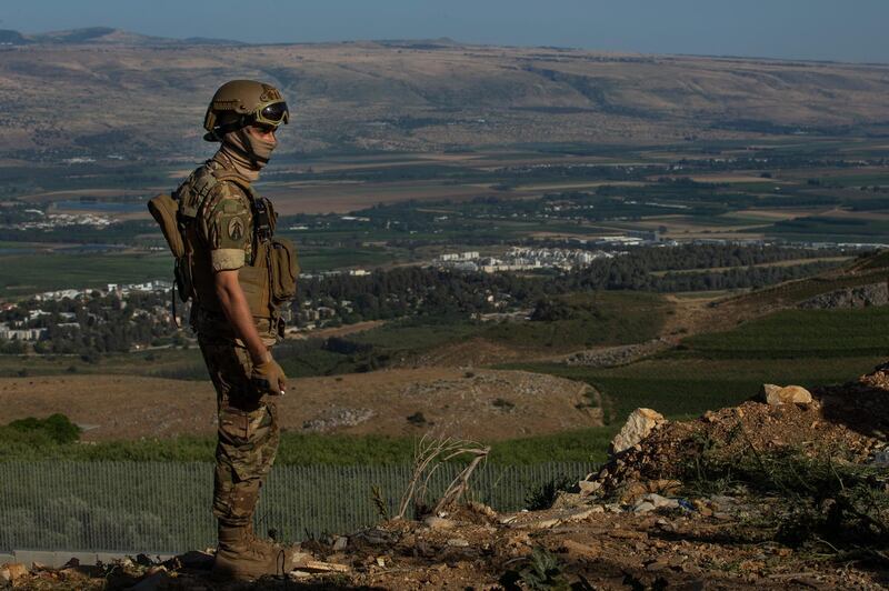 ADAISSEH, LEBANON - MAY 16: A Lebanese soldier stands guard preventing demonstrators from going closer to the Lebanon-Israel border during a demonstration to show solidarity with Palestinians on May 16, 2021 in Adaisseh, Lebanon. Gun shots were heard from the Israeli side, but no injuries were reported. (Photo by Daniel Carde/Getty Images)