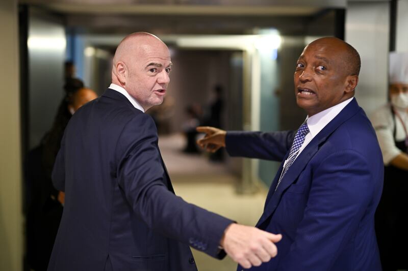 Fifa president Gianni Infantino, left, and Patrice Motsepe, billionaire founder of African Rainbow Minerals, arrive at the forum's venue in Davos. EPA