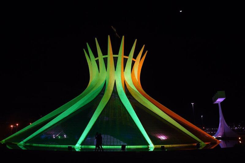 View of Brasilia's Metropolitan Cathedral illuminated in green and yellow on Wednesday. Evaristo SA / AFP / June 4, 2014