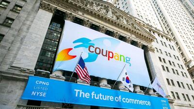 A banner for South Korea's Coupang, the South Korean equivalent of Amazon in the US, or Alibaba in China, adorns the New York Stock Exchange facade before the company's IPO last month. AP