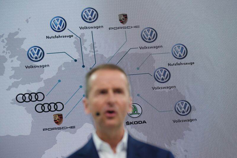 WOLFSBURG, GERMANY - MARCH 12: Herbert Diess, CEO of German automaker Volkswagen AG, stands in front of a map showing Volkswagen and Volkswagen-owned brands production facilities across Europe as he speaks at the company's annual press conference at Volkswagen headquarters on March 12, 2019 in Wolfsburg, Germany. Diess said he is committing the company to an electric car future and has set ambitious greenhouse gas reduction goals for the VW by aiming to make the entire company CO2 neutral by 2050. (Photo by Sean Gallup/Getty Images)
