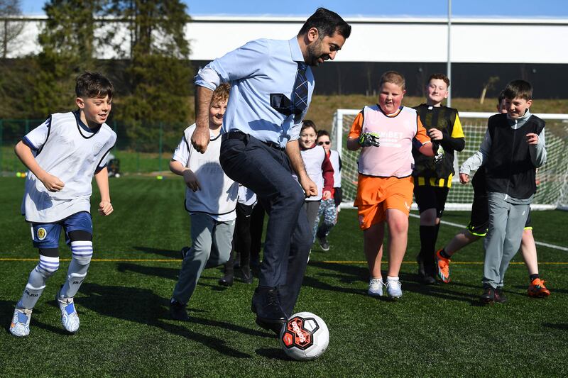 Scotland's First Minister, Humza Yousaf, during a visit to a school holiday club in Ayr, south-west Scotland, on Monday. AFP