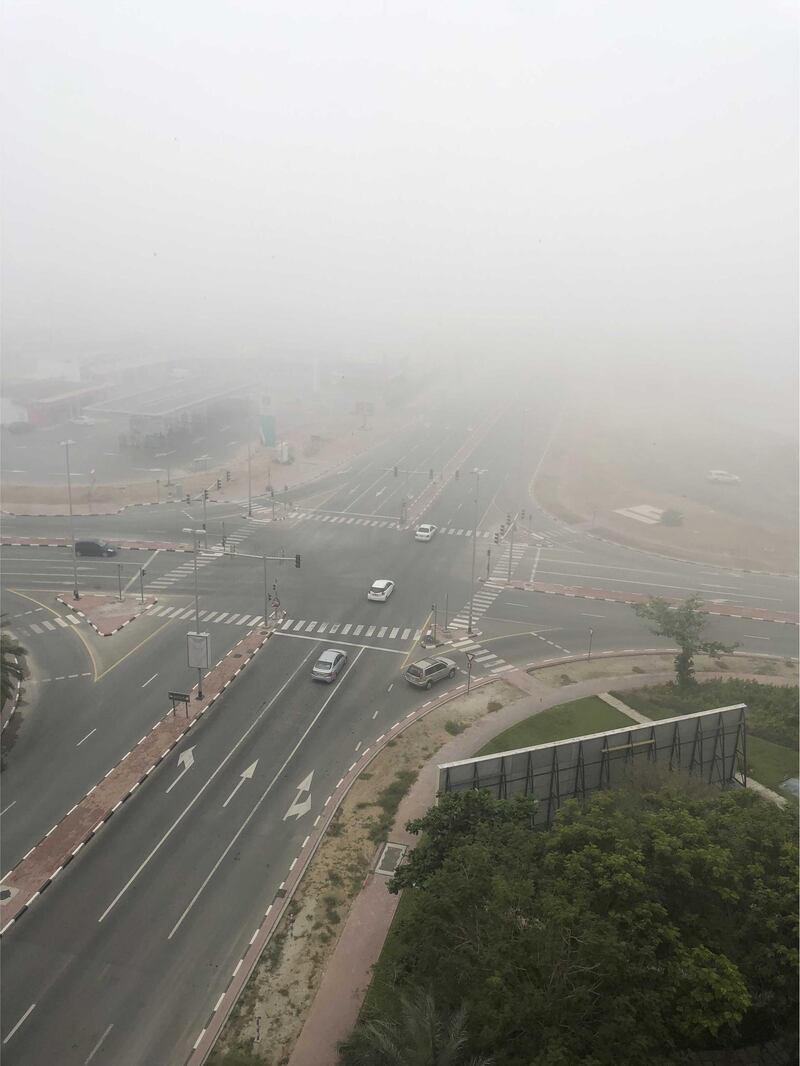 Early morning fog is seen at a crossroads junction, close to Ibn Batutta Mall in Dubai. James O'Hara / The National