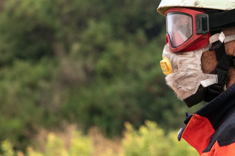 A firefighter battling the blaze. AP