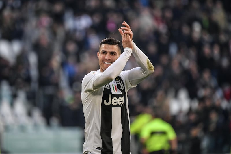 Juventus' Portuguese forward Cristiano Ronaldo celebrates at the end of the Italian Serie A football match Juventus vs Sampdoria on December 29, 2018 at the Juventus stadium in Turin.  / AFP / Marco BERTORELLO
