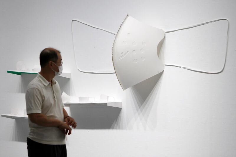 A visitor attends an art exhibition on the coronavirus pandemic in the southeastern city of Daegu, South Korea. EPA