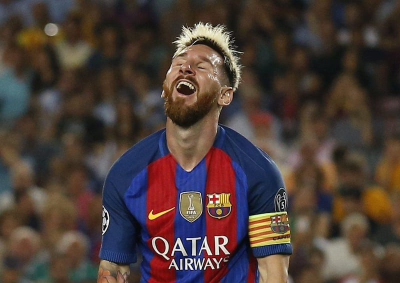 Barcelona's Lionel Messi reacts to one of his three goals Tuesday night against Celtic. Albert Gea / Reuters