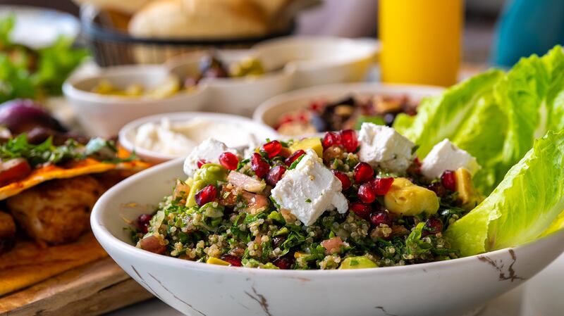 Vegetable salad with olive oil, molasses and walnuts, pomegranate, cheesy sumac crust from Beirut Sur Mer.