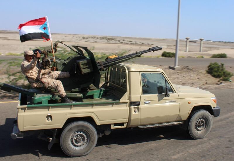 Fighters with Yemen's Security Belt Force dominated by members of the the Southern Transitional Council (STC) seeking independence for southern Yemen, are seen in a reinforcements convoy heading from the southern city of Aden to Abyan province on November 26, 2019, amid tensions with the forces of Saudi-backed President Abedrabbo Mansour Hadi. Saudi Arabia brokered on November 5 a power sharing agreement between Yemen's internationally recognised government and southern separatists of the STC, in a bid to end infighting that had distracted the Riyadh-led coalition from its battle against the Iran-backed Huthi rebels. / AFP / Saleh Al-OBEIDI
