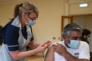 Nurse Maggie Clark administers a dose of the AstraZeneca/Oxford Covid-19 vaccine to a patient at a vaccination centre set up at the Fiveways Islamic Centre and Mosque in Nottingham, central England. AFP