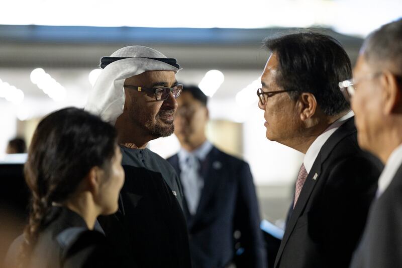 Sheikh Mohamed bids farewell to a member of the Korean delegation at the air base. Abdulla Al Neyadi / UAE Presidential Court 
