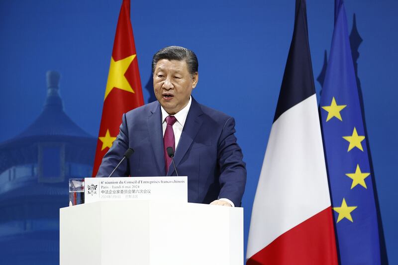Mr Xi speaks at the sixth meeting of the business council. AP
