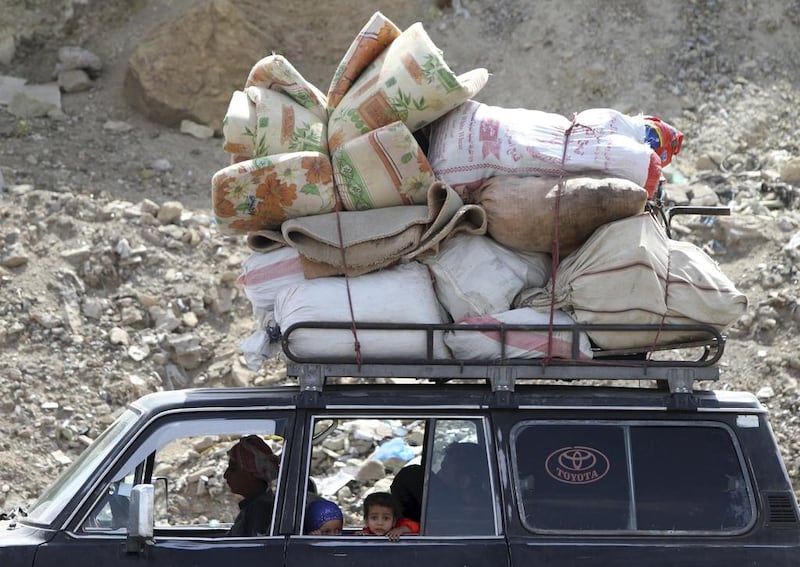A family flees with their belongings last week, fearing renewed airstrikes in Sanaa.Mohamed Al Sayaghi / Reuters