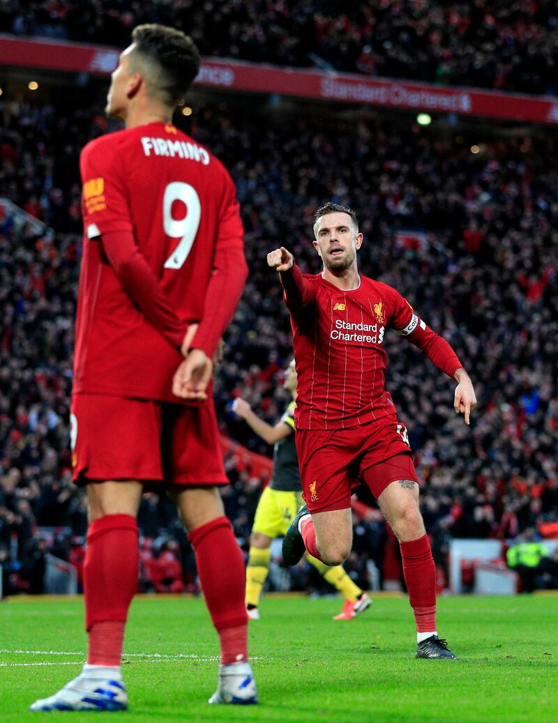 Liverpool's Jordan Henderson celebrates scoring his side's second goal against Southampton at Anfield. PA