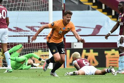 Wolverhampton Wanderers' Belgian midfielder Leander Dendoncker (C) celebrates after he scores his team's first goal during the English Premier League football match between Aston Villa and Wolverhampton Wanderers at Villa Park in Birmingham, central England on June 27, 2020. RESTRICTED TO EDITORIAL USE. No use with unauthorized audio, video, data, fixture lists, club/league logos or 'live' services. Online in-match use limited to 120 images. An additional 40 images may be used in extra time. No video emulation. Social media in-match use limited to 120 images. An additional 40 images may be used in extra time. No use in betting publications, games or single club/league/player publications.
 / AFP / POOL / RUI VIEIRA                          / RESTRICTED TO EDITORIAL USE. No use with unauthorized audio, video, data, fixture lists, club/league logos or 'live' services. Online in-match use limited to 120 images. An additional 40 images may be used in extra time. No video emulation. Social media in-match use limited to 120 images. An additional 40 images may be used in extra time. No use in betting publications, games or single club/league/player publications.
