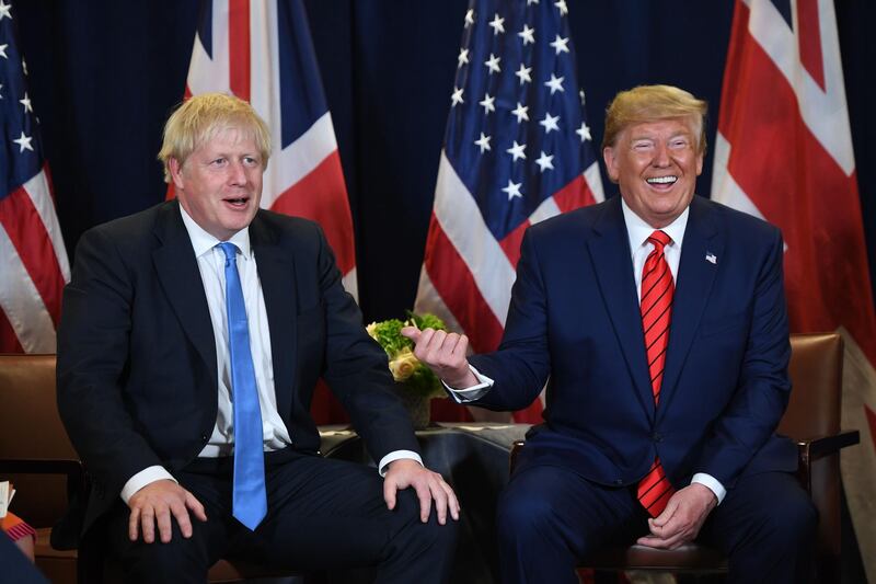 (FILES) In this file photo taken on September 24, 2019 US President Donald Trump and British Prime Minister Boris Johnson hold a meeting at UN Headquarters in New York, September 24, 2019, on the sidelines of the United Nations General Assembly. US President Donald Trump flies into Britain next week, just days before its general election -- and if earlier visits are any guide, fireworks are expected. Trump is in town for a summit marking 70 years of the NATO military alliance, but his presence risks disrupting the campaign for the December 12 vote as it enters the final straight.
 / AFP / SAUL LOEB
