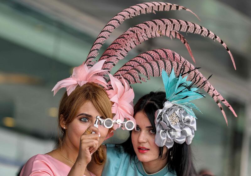 Racegoers pull out all the stops with fantastic fascinators and outfits. AFP