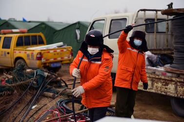 Rescue workers race to free miners trapped inside a gold mine in Shandong province, China. AFP 