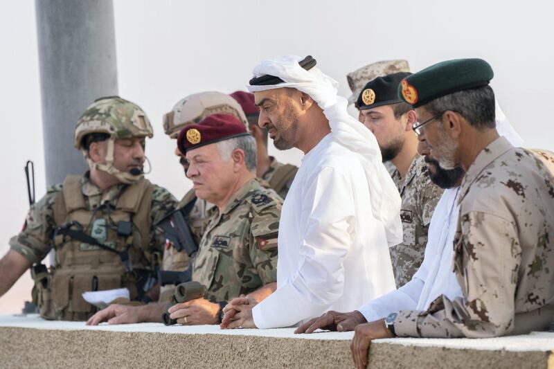 AL DHAFRA REGION, ABU DHABI, UNITED ARAB EMIRATES - June 26, 2019: (R-L) HE Lt General Hamad Thani Al Romaithi, Chief of Staff UAE Armed Forces, HH Sheikh Mohamed bin Zayed Al Nahyan, Crown Prince of Abu Dhabi and Deputy Supreme Commander of the UAE Armed Forces and HM King Abdullah II, King of Jordan, attend the UAE and Jordan joint military drill, Titled ‘Bonds of Strength’, at Al Hamra Camp.

( Rashed Al Mansoori / Ministry of Presidential Affairs )
---